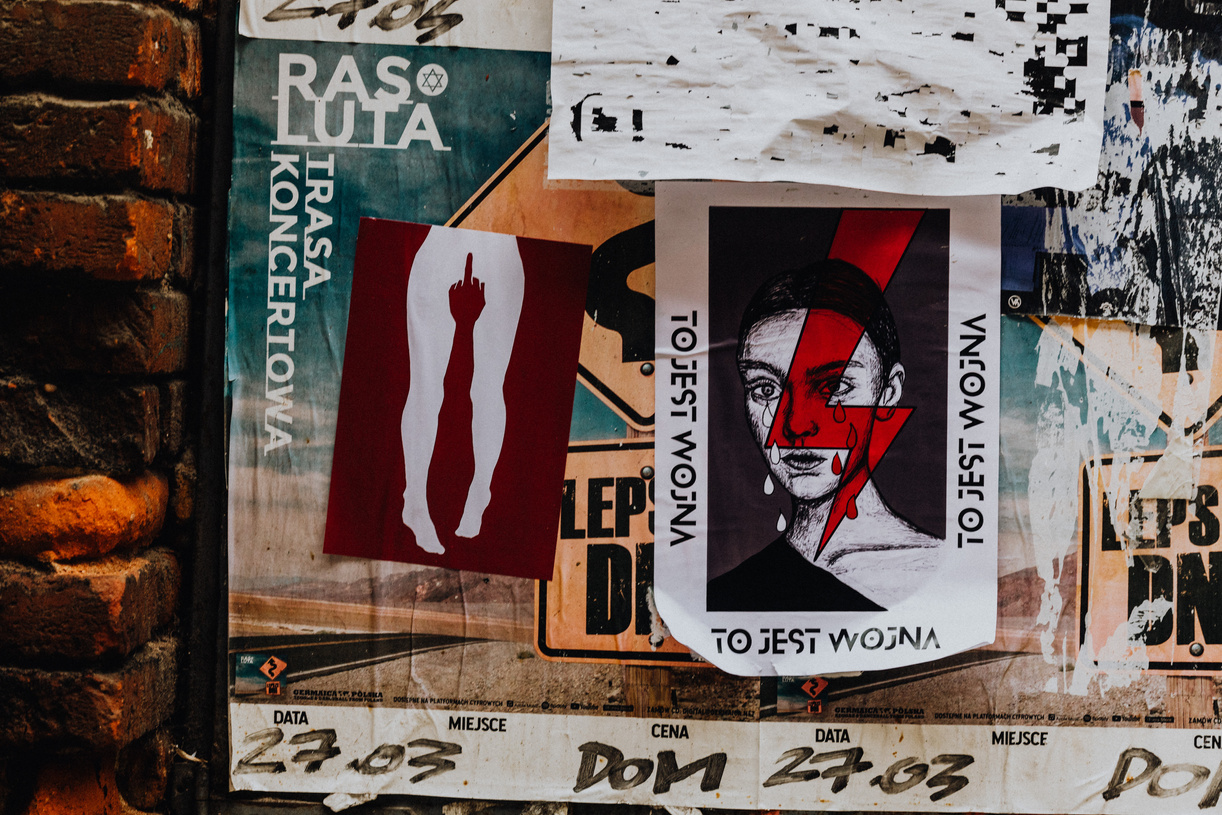 Leaflets and Posters Attached to a Wall in City